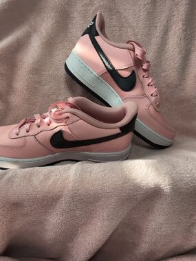 Nike Women’s Pink Low-Top Sneakers with Black Swoosh